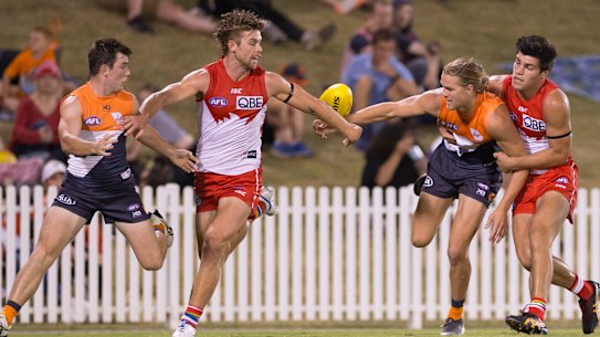 Up for grabs: Harrison Himmelberg of the Giants is tackled by Harry Cunningham.