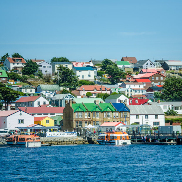 Colourful harbourside homes dominate the barren landscape.