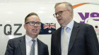 Alan Joyce and Anthony Albanese at the Qantas unveiling of its Yes logo last week.