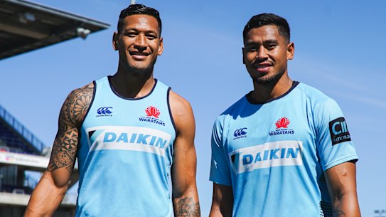 Big brothers: Israel and john Folau pose for a photo before the Waratahs' match against the Sunwolves in round seven. 