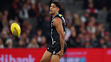 Nasiah Wanganeen-Milera grabs his hamstring. 