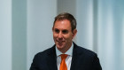 Treasurer Jim Chalmers arrives at this press conference this morning.