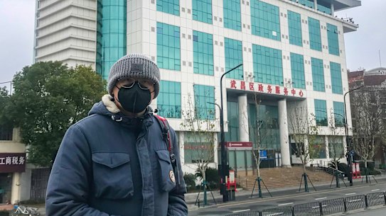 Australian citizen Moko Yong travelling around Wuhan on a shared bike, the only public transportation available in the city. 