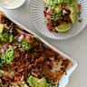 Loaded double-bean nachos with fresh pico de gallo.