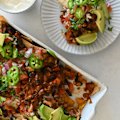 Loaded double-bean nachos with fresh pico de gallo.