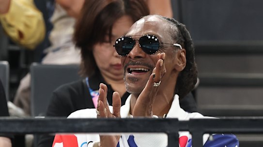 Snoop Dogg cheers during the gymnastics on day two at Bercy Arena.