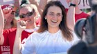 Ali France celebrates her victory the morning after usurping Peter Dutton from the seat of Dickson in the 2025 federal election.
