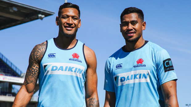Big brothers: Israel and john Folau pose for a photo before the Waratahs' match against the Sunwolves in round seven. 