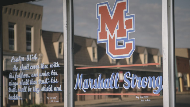 A psalm and a message of solidarity on a downtown shop window in the wake of the Marshall County High School shooting.