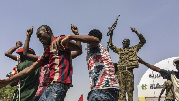 Sudanese celebrate after officials said the military had forced longtime autocratic President Omar al-Bashir to step down after 30 years in power in Khartoum, Sudan.