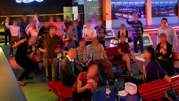 David Reid, standing right, at a work function at a Sydney bowling alley.