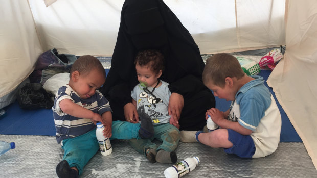 Australian woman Shayma Assaad and her three sons at the al-Hawl camp in north-eastern Syria in April. 