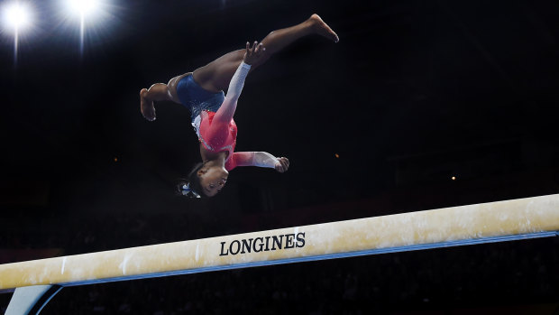 Superstar: Biles performs on the balance beam during the women's team finals on day five.