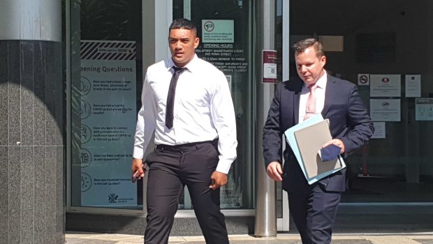 Brisbane Broncos player Teui Robati leaves court with his lawyer Dave Garratt.