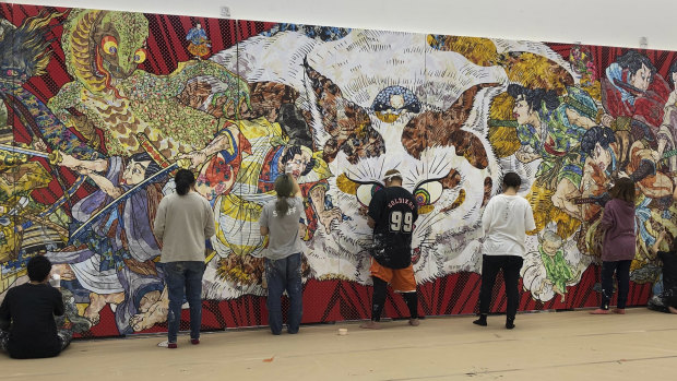 Staff at Takashi Murakami’s studio in Saitama, Japan, work on the detailed decorative surface of Murakami’s new work for the Art Gallery of NSW.