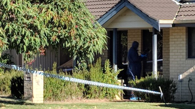 Forensic police at the Queens Park home.