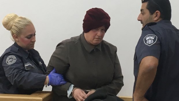 Malka Leifer being forcefully led away after she left court early feeling unwell on May 2, 2018. 