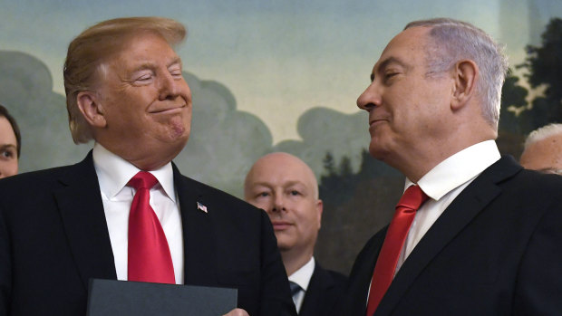 President Donald Trump smiles at Israeli Prime Minister Benjamin Netanyahu last month.