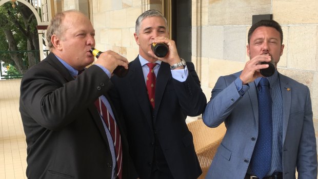 KAP MPs Shane Knuth, Robbie Katter and Nick Dametto drink to the expected passing of the Rural Hotels Concessions Bill.