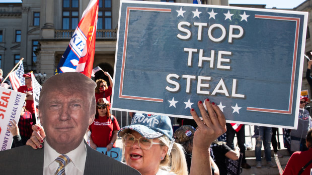 Demonstrators gather during a "Stop The Steal" rally outside of the Georgia State Capitol in Atlanta on Saturday.