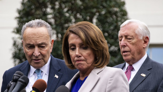 House Speaker Nancy Pelosi, centre, said the Democrats would introduce bills to supply funds to restart government services. 
