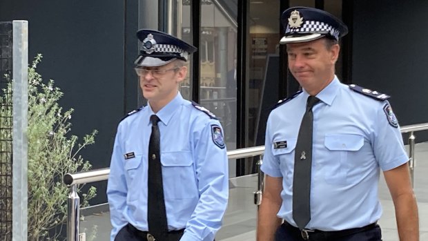 Sergeant Ian Douglas (left) leaves Toowoomba Magistrates Court on Thursday afternoon.