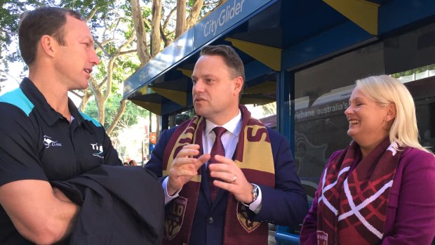 Brisbane lord mayor Adrian Schrinner, deputy mayor Krista Adams and Darren Lockyer inspected the two competing State of Origin buses on Tuesday morning.