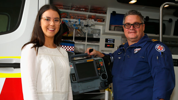 CPR and a public-access defibrillator used by off-duty nurse Grace Jones, seen here with  ICU paramedic Brian Parcell, saved Greg Page's life. 