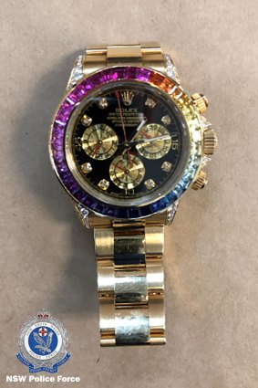Strike Force Raptor allegedly seized a number of items from the Bankstown home, including a Rolex Daytona Rainbow watch.