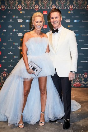 Roxy Jacenko, wearing her famous 'mullet dress' with her husband, Oliver Curtis, at the exclusive Gold Dinner this year.