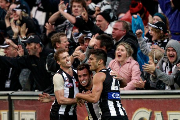 Jarryd Blair is congratulated by teammates after kicking the winning goal.