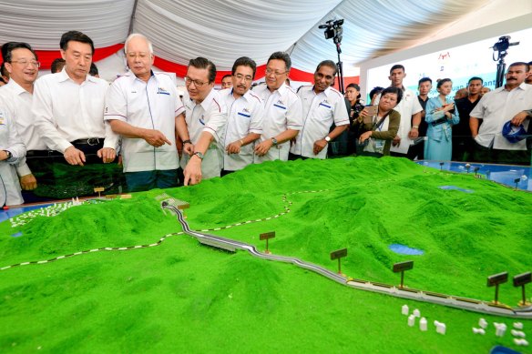 Then Malaysian Prime Minster Najib Razak, third from left, looks at modals of ECRL (East Coast Rail Link) during the project launching in Kuantan, east cost of peninsula Malaysia in 2018.