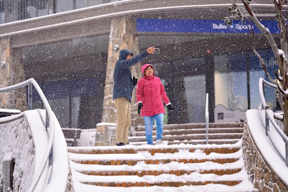 Jill and her partner take a selfie in the fresh snow at Mount Buller.