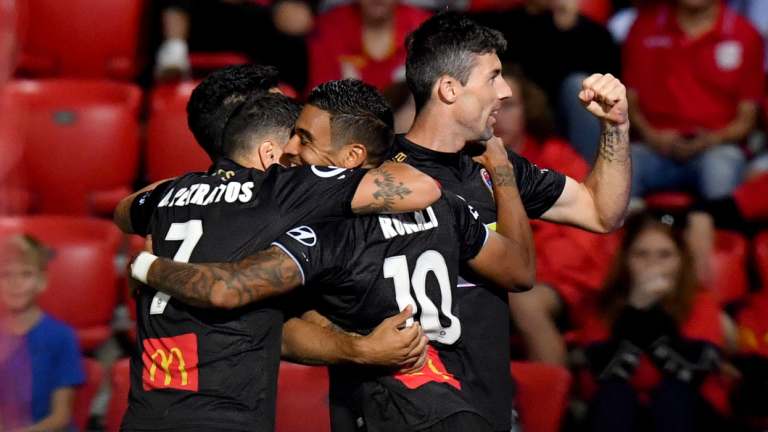 The leveller: Newcastle players celebrate a goal by Ronald Vargas.