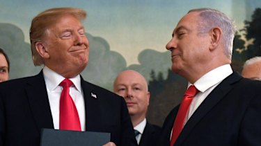President Donald Trump smiles at Israeli Prime Minister Benjamin Netanyahu last month.