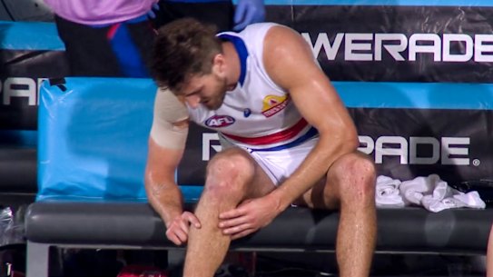 Marcus Bontempelli examines his knee late in the clash between the Western Bulldogs and the Brisbane Lions.