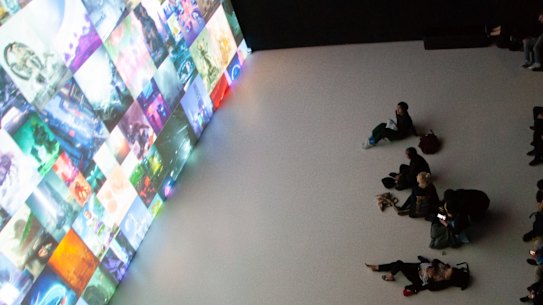 Viewers taking in Beeple’s work during a live showcase.