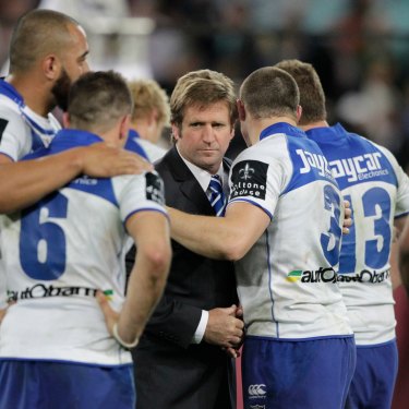Des Hasler consoles the players after the heartache of the 2012 grand final loss to Melbourne.