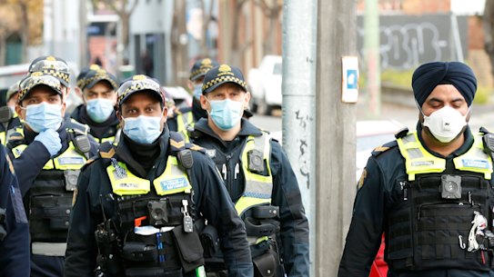 About 500 police are patrolling the nine social housing towers under hard lockdown at any one time.