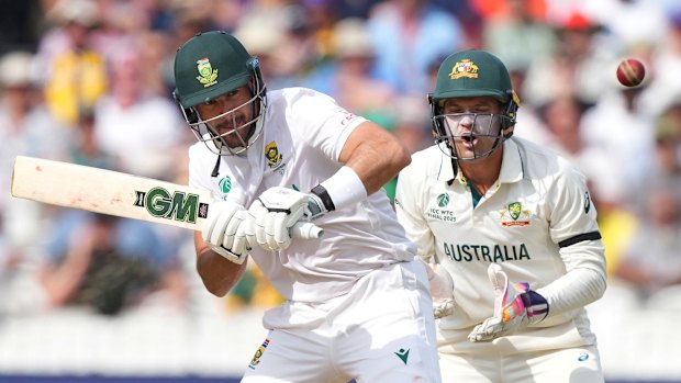 Australia’s wicketkeeper Alex Carey, right, reacts as South Africa’s Aiden Markram plays a shot on day three.