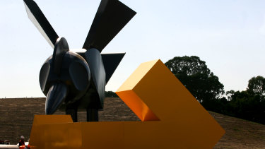 The giant black steel bird next to the EastLink freeway in Melbourne's south-east, eyeing its cuboid worm prey. By Emily Floyd.