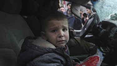 A boy cries after Syrian government air strikes hit Ariha, in Idlib province, Syria, on January 15.