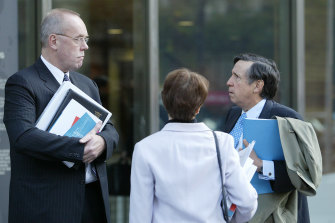 Coghlan (right) outside the County Court in his days as Director of Public Prosecutions.
