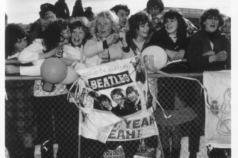 Fans greet the Beatles on their arrival at Essendon Airport in 1964.