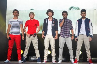 Baby Harry Styles (middle) with One Direction on stage in Australia in 2012. 