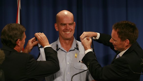 Premier John Brumby and emergency services minister Bob Cameron appoint Simon Overland the new Chief Commissioner of Victoria Police in March 2009. 