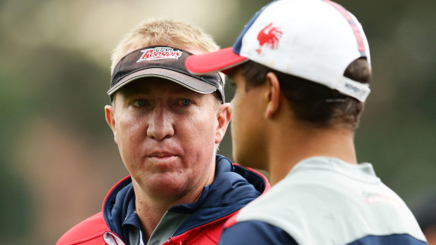 Trent Robinson and Latrell Mitchell share a word in their Roosters days.