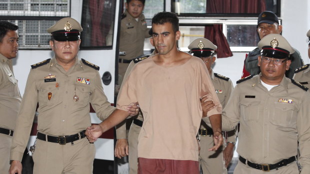 Hakeem Al-Araibi arrives at the Bangkok court on Monday with his legs shackled.