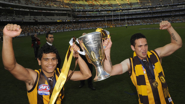 Rioli with teammate Mark Williams and the 2008 premiership cup.