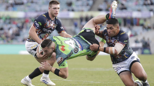 Crashing down: Nick Cotric heads for the turf in the loss to North Queensland at Canberra Stadium yesterday. The injury-riddled Raiders need to get back on track. 